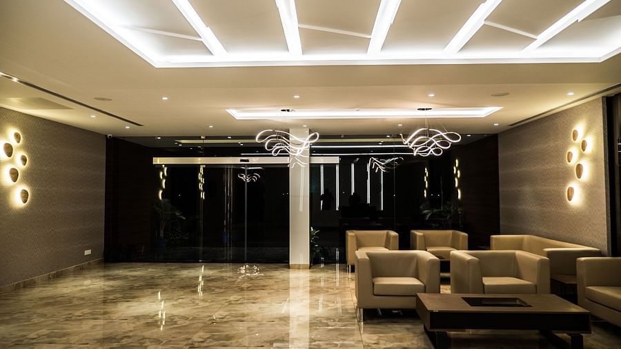 Lobby area with comfortable seating at Grand Ashok, Thanjavur.