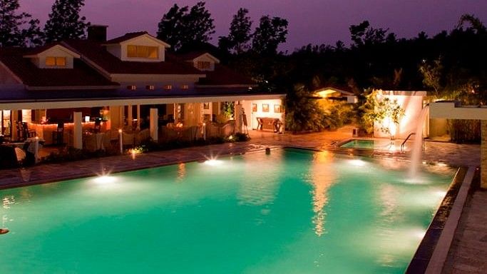 Dining by the pool, Amanvana Resort And Spa, Coorg Resort