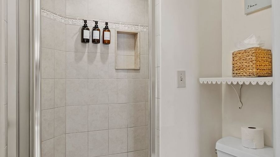 Compact bathroom with glass shower and toilet at Hartstone Inn