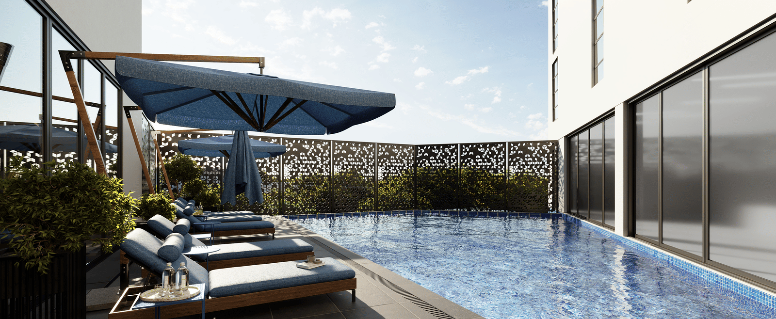 A view of the swimming pool next to lounging chairs at The Pelican Hotel, Accra.