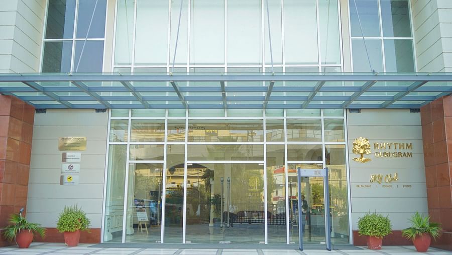 The entrance view with logos of the hotel at Rhythm Gurugram