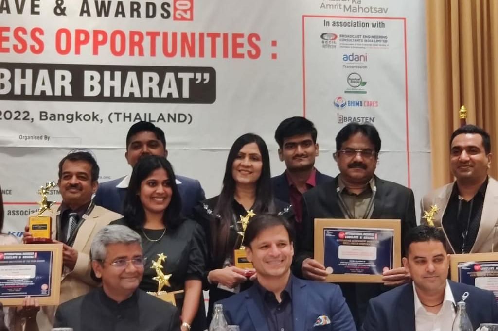 Image of member of the resort in an award function. 