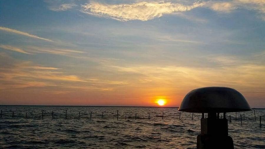 Orange sunset on seawaters - Rhythm Kumarakom