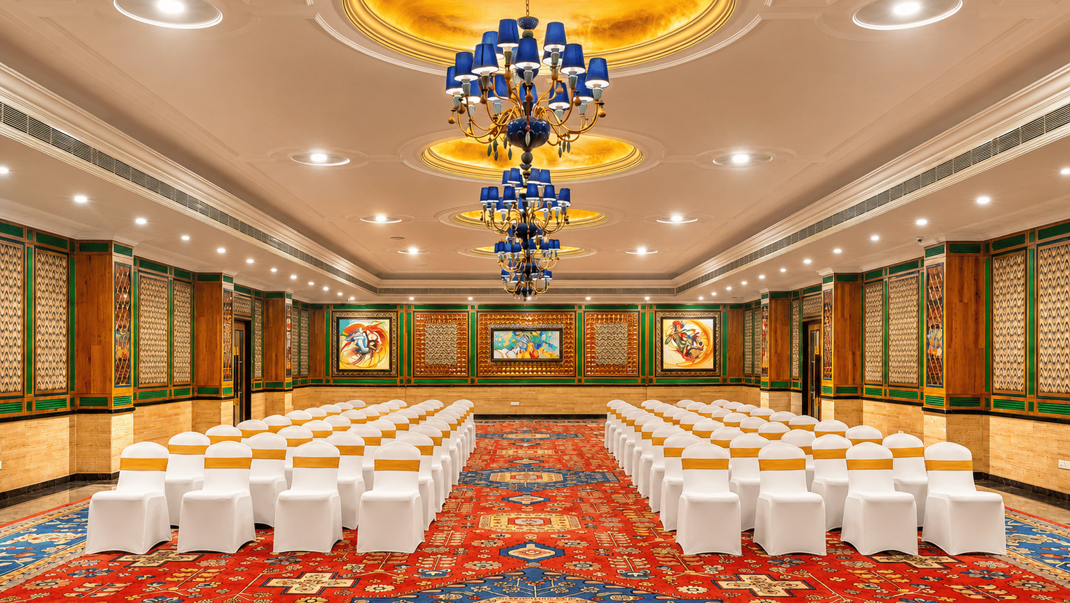 Orchid Hall banquet setup with ornate chandeliers at Mayfair Oasis Resort, Jharsuguda
