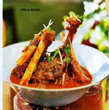 A bengali newspaper clipping featuring a non vegetarian dish.