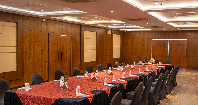 A conference room with a long table set for a meeting.- Bamboo Saa Resort & Spa, Udaipur.