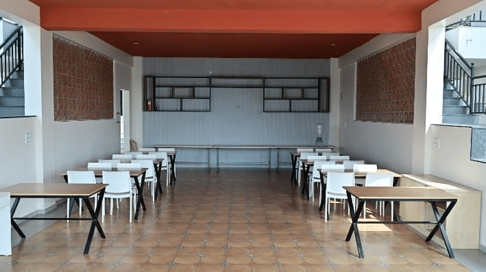 Wide shot of the dining space at hillock vista homestay by aarika.
