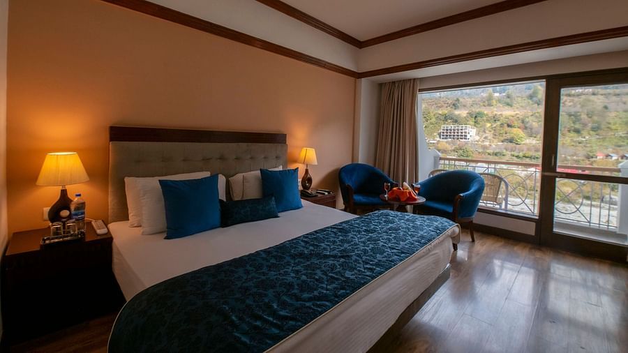 a warmly-lit interior of Riverview Room at Mastiff Grand, Manali