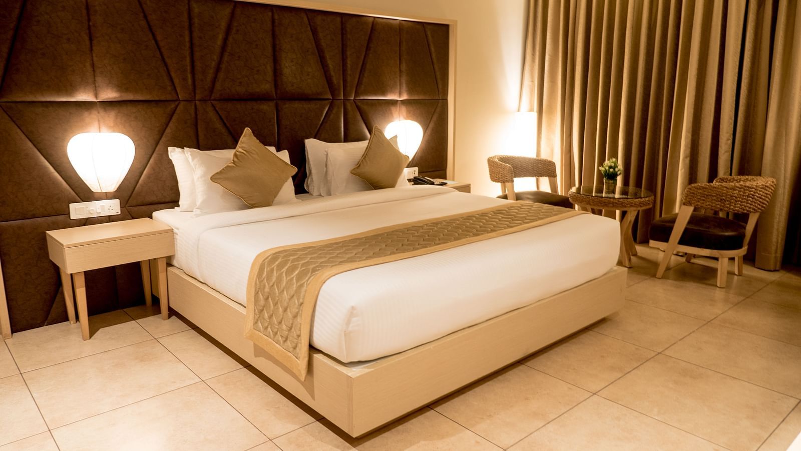 view of king size bed of Premium Room at Cholaa Dynasty, Kumbakonam