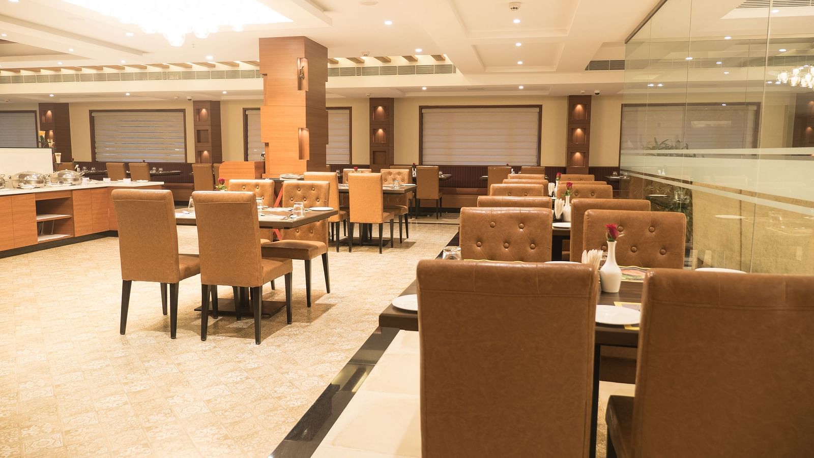 dining of a restaurant with warm lights of MM Legacy, Kanchipuram