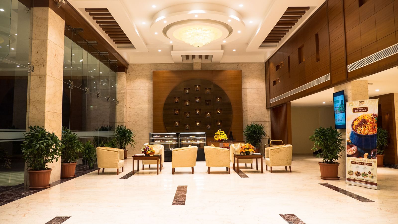 reception area with comfortable seating and warm lights of MM Legacy, Kanchipuram