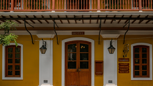 The Entrance of a Hotel in pondicherry with yellow walls