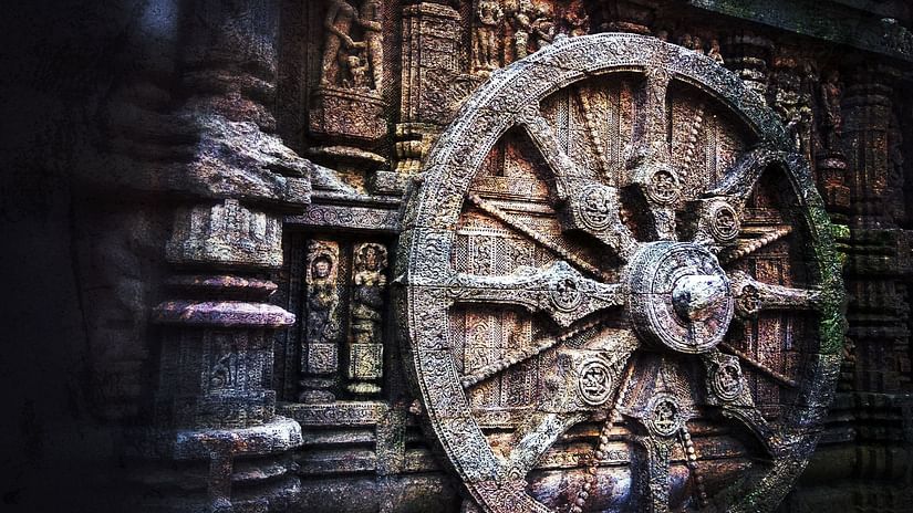 An intricately carved stone wheel on the wall of the Sun Temple at Konark, reflecting the sophistication of ancient Indian architecture.
