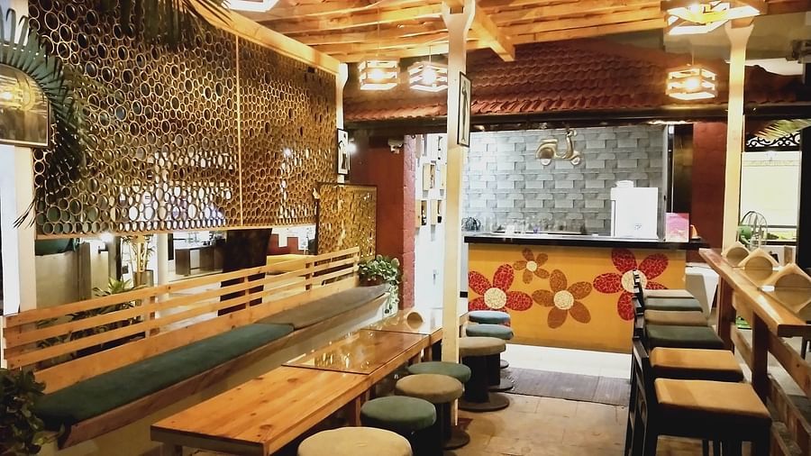 Tables and beautiful tiny bar stools at highground bar Kyriad Prestige Calangute, Goa