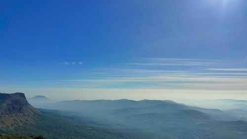 An overview of the mountains near chikmagalur with the sun shining above
