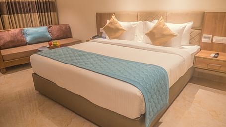 view of a king size bed of Luxury Sea View Room