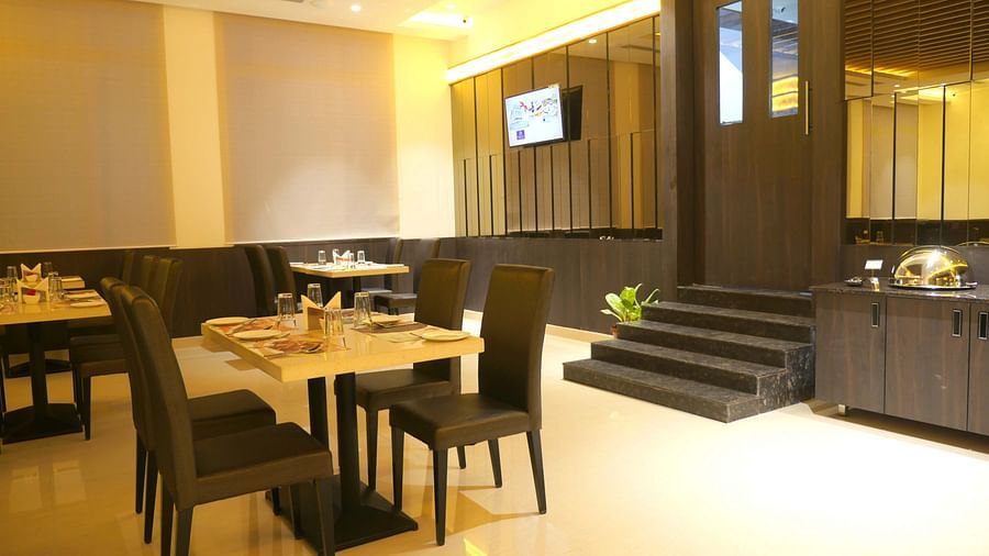 dining of a restaurant with warm lights of ASR Parklane, Hosur