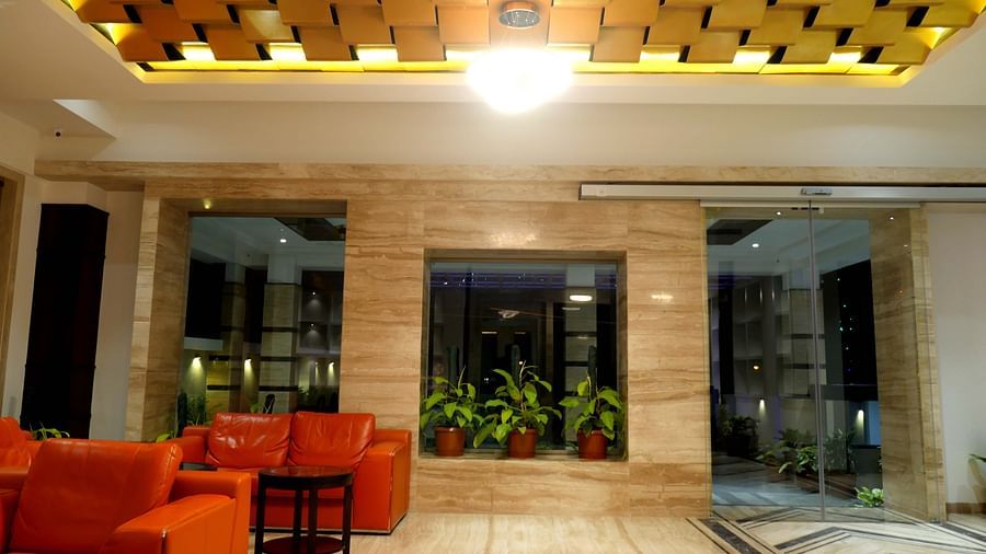 lobby with comfortable chairs and warm lightining of ASR Parklane, Hosur