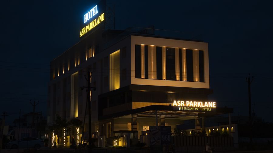  A far exterior view of the property building during the night time. 