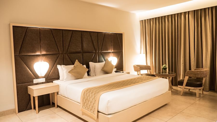 view of king size bed of Premium Room at Cholaa Dynasty, Kumbakonam