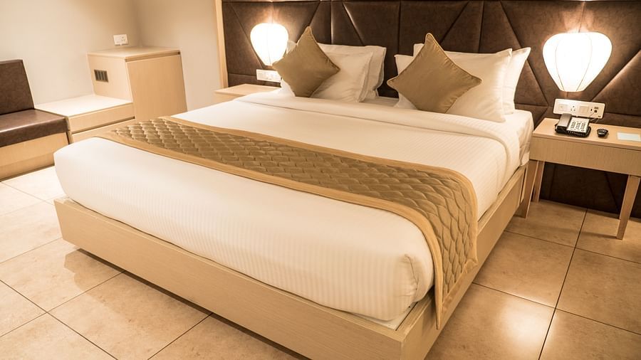 view of king size bed of Premium Room at Cholaa Dynasty, Kumbakonam