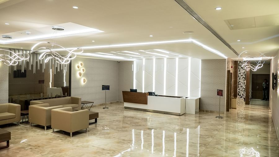 Lobby area with comfortable seating at Grand Ashok, Thanjavur.