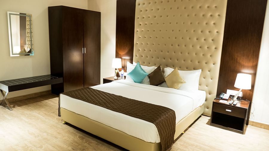 A large bed in Suite at Grand Ashok, Thanjavur.