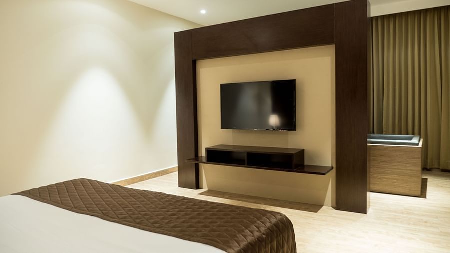 A view of the TV from the bed of Suite at Grand Ashok, Thanjavur.
