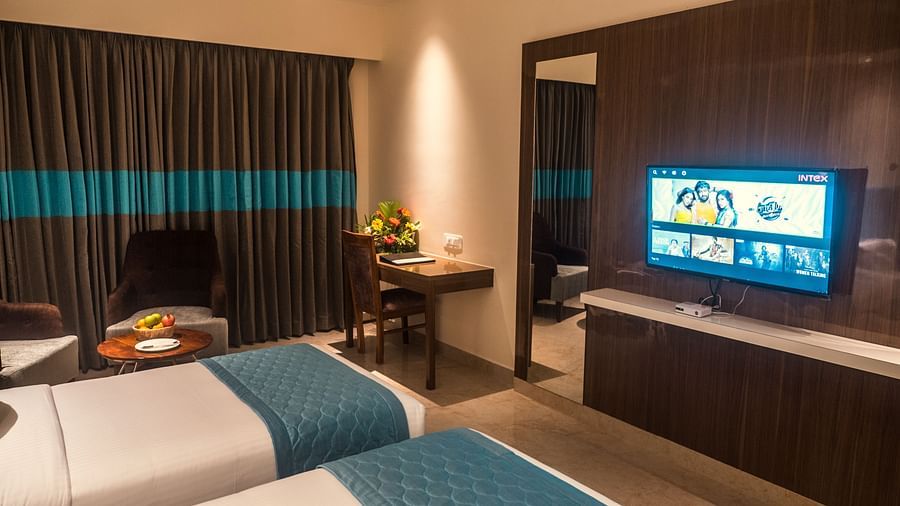 view of two king size beds and TV of Suite 