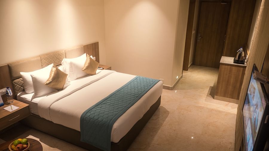view of a king size bed of Luxury Sea View Room