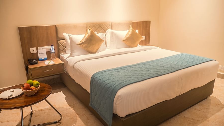 view of a king size bed of Luxury Sea View Room