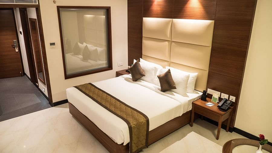view of king size bed of Luxury Room of MM Legacy, Kanchipuram