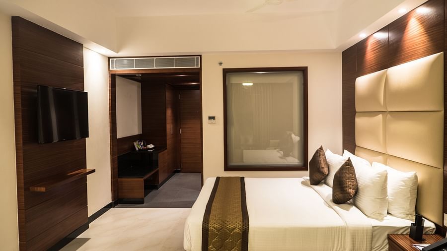 view of a king size bed of a Premium Suite Room of MM Legacy, Kanchipuram