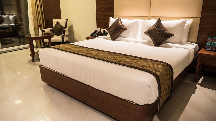 view of a king size bed of a Premium Suite Room of MM Legacy, Kanchipuram