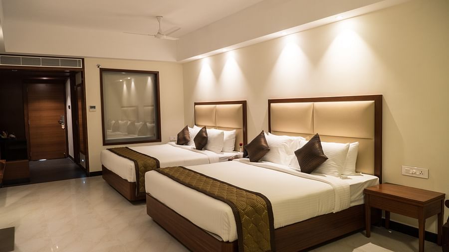 view of two king size beds of Luxury Suite Room of MM Legacy, Kanchipuram