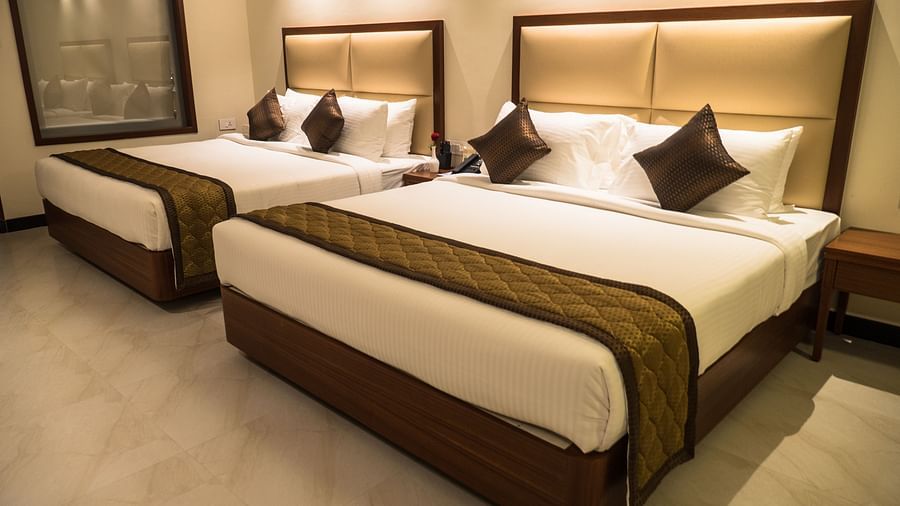 view of two king size beds of Luxury Suite Room of MM Legacy, Kanchipuram