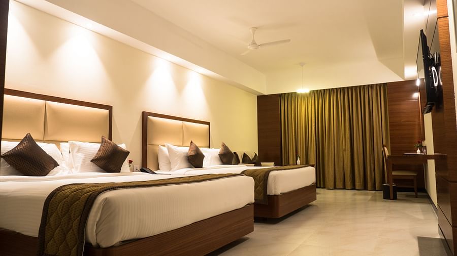 view of two king size beds of Luxury Suite Room of MM Legacy, Kanchipuram