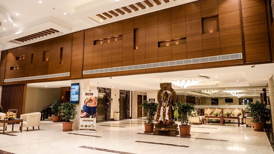 reception area with comfortable seating and warm lights of MM Legacy, Kanchipuram