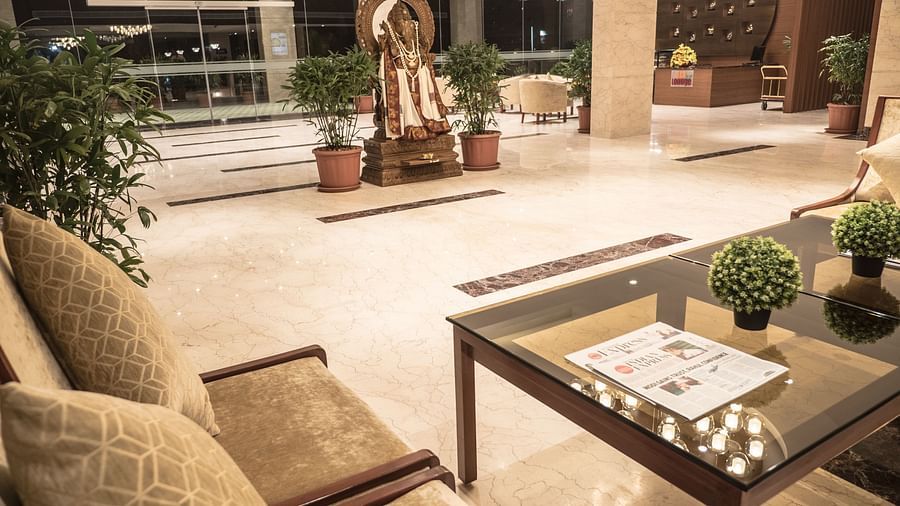 reception area with comfortable seating and warm lights of MM Legacy, Kanchipuram