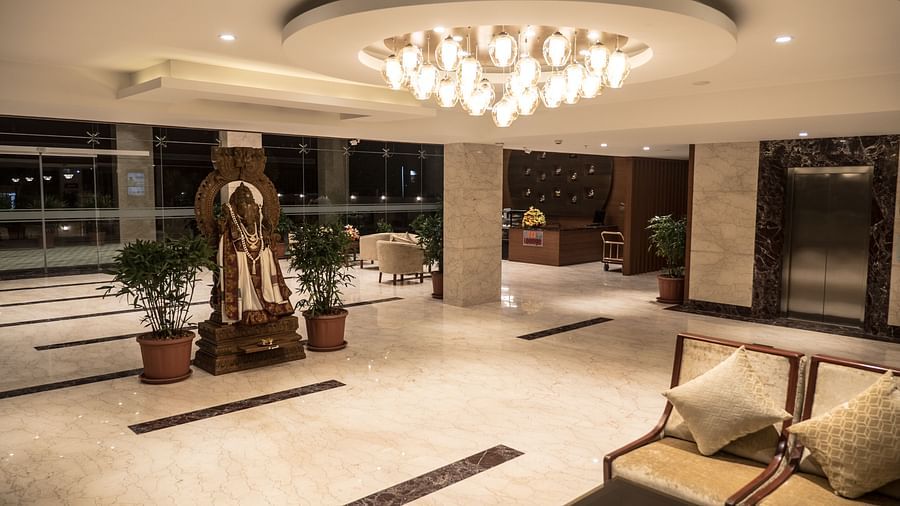reception area with comfortable seating and warm lights of MM Legacy, Kanchipuram