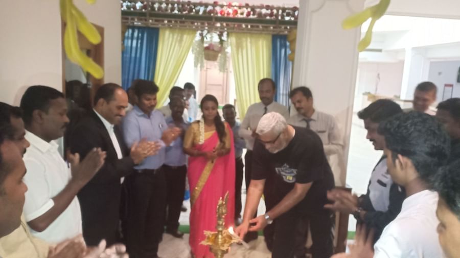  A man about to light a celebratory lamp at SRM Hotel Tiruchirappalli- Hotel 