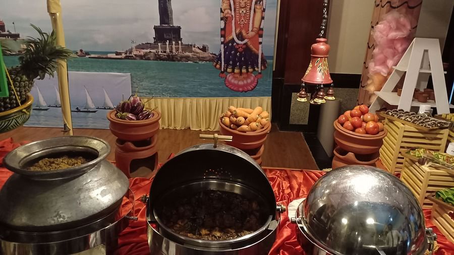 Food containers filled with food on table at SRM Hotel Tiruchirappalli- Hotel 