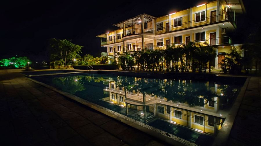 Facade of The Kanila Resort with a swimming pool taken during the night.