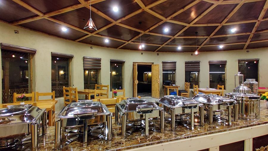 A closer view of the buffet setup at dining area at White Sands Resort, Ladakh showcasing the variety of food and serving dishes available.