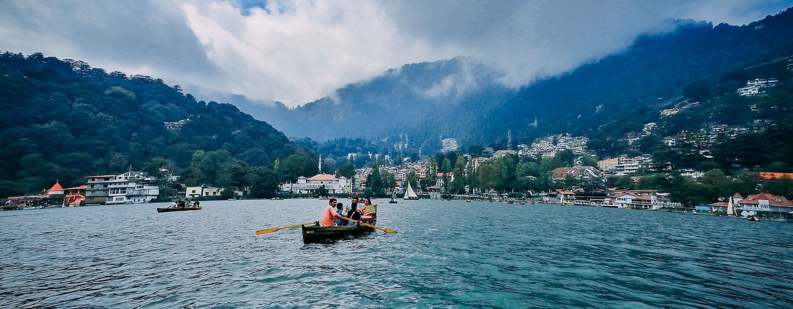 A wide view of a boating in Naini lake during the day