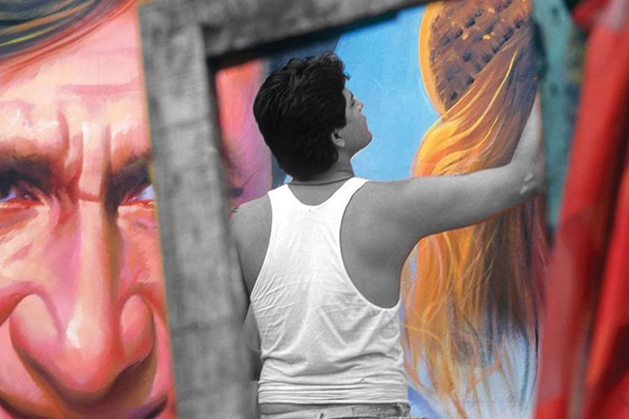 man painting on the wall