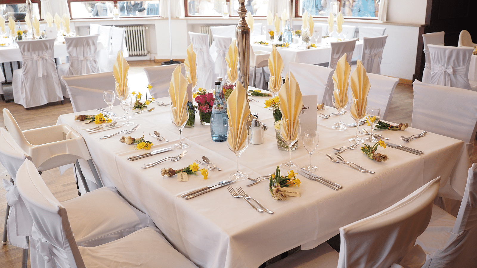 Image of a decorated white table in a Banquet Hall