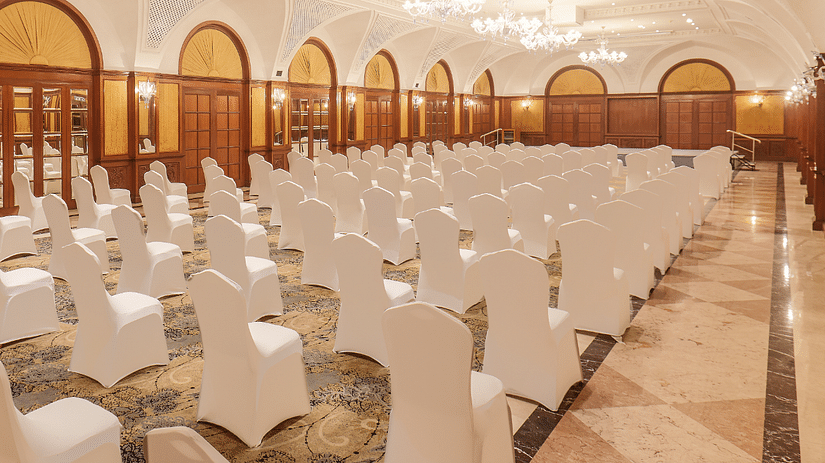 A side angle view of the Town Hall at The Residency Tower, Chennai, showcasing a floating crowd seating arrangement. The space is illuminated with bright lighting, enhancing the vibrant atmosphere for events and gatherings.