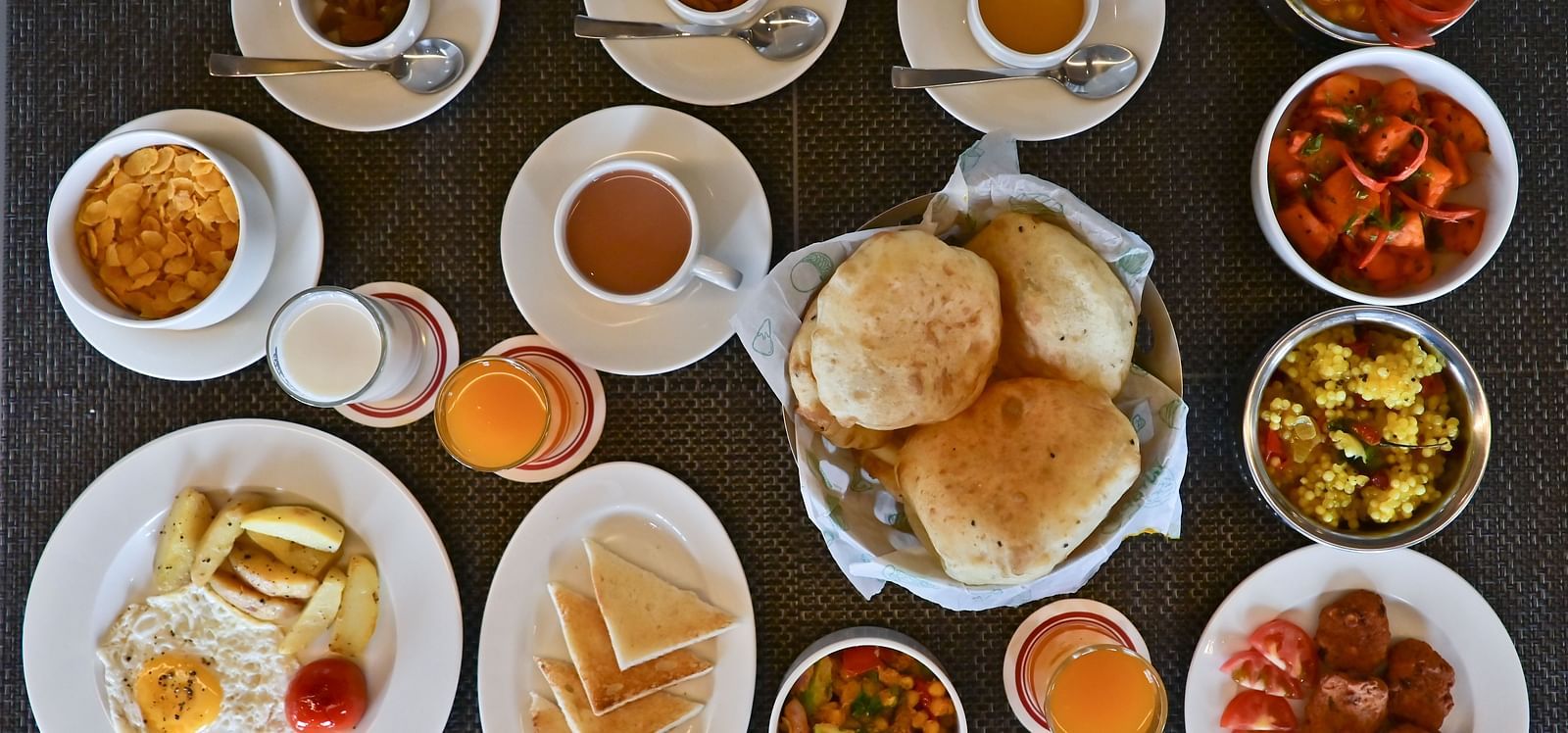 A table filled witn a variety of food items at The Soma Hotel by Avianna Group, Darjeeling