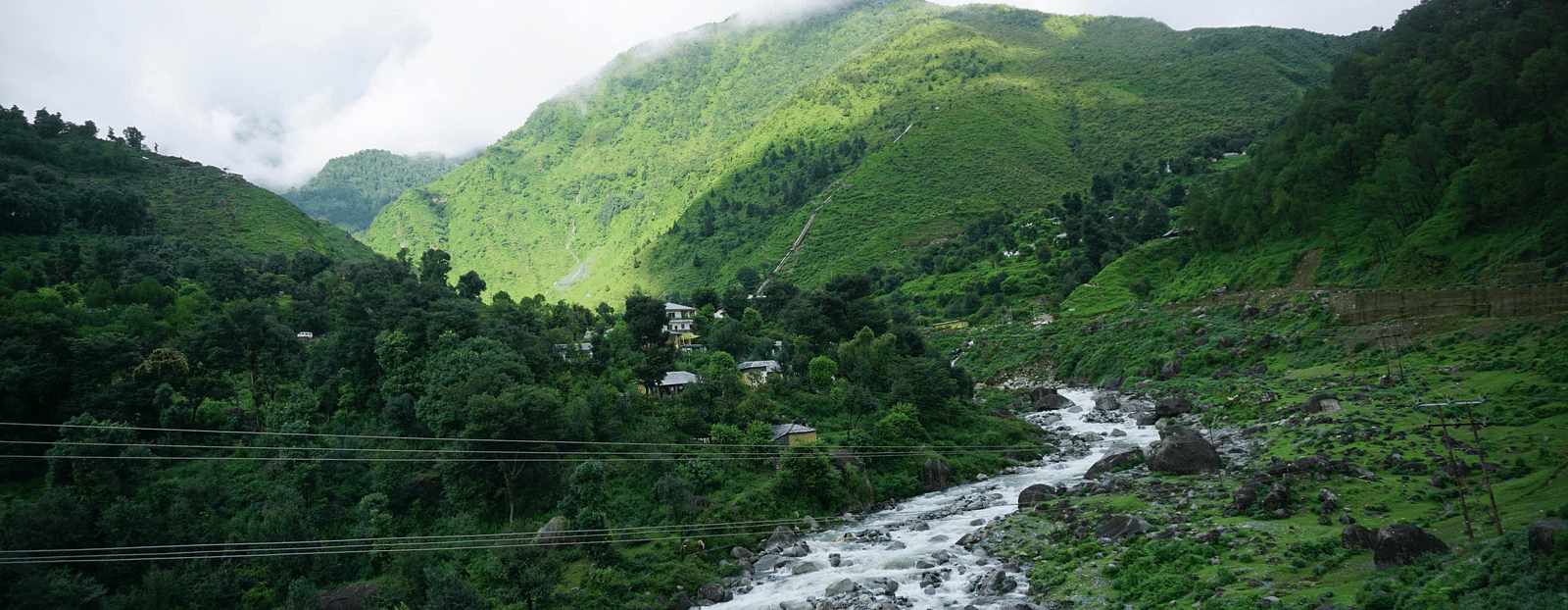 a valley with a stream flowing through it